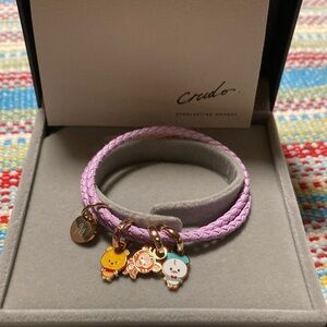 Disney crudo Purple Braided Bracelet with Charms. One charm has the initial M